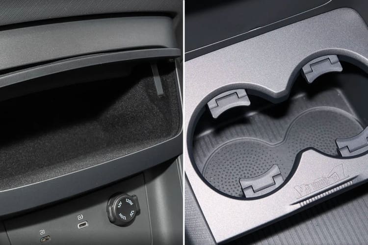 Спереди в салоне есть куда положить телефон и поставить стаканчик